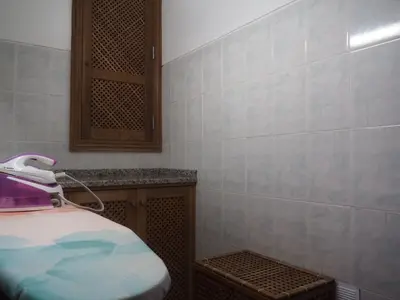 a bathroom with a phone sitting on a counter at Camacho Residence in Funchal