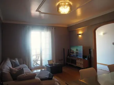 a living room with a couch and a television at Camacho Residence in Funchal