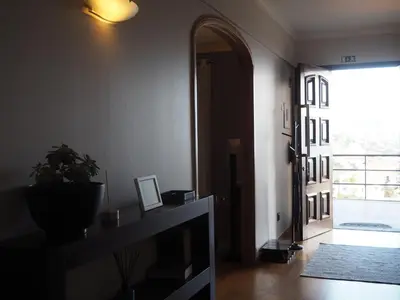 a room with a hallway with a door and a plant at Camacho Residence in Funchal