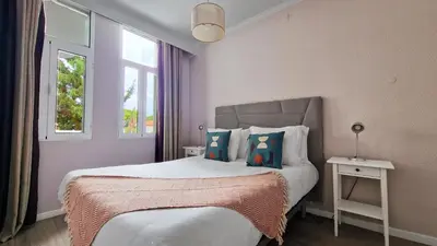 a bedroom with a bed and a window at Pino's Getaway by LovelyStay in Funchal