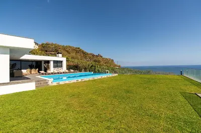 a view of the backyard of a villa with a swimming pool at Oak Tree Ocean View in Ponta do Sol