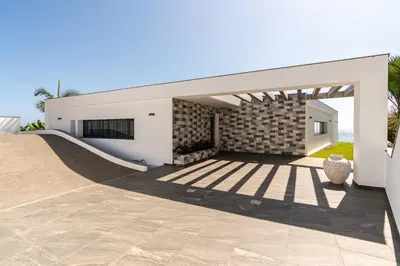 a house with a skateboard ramp in front of it at Oak Tree Ocean View in Ponta do Sol