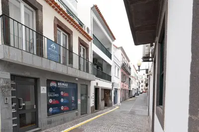 an empty street in a city with buildings at Tranquilidade, Quiet Apartament in Funchal City Center in Funchal