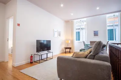 a living room with a couch and a tv at GuestReady - Relaxing Retreat in Madeira in Machico