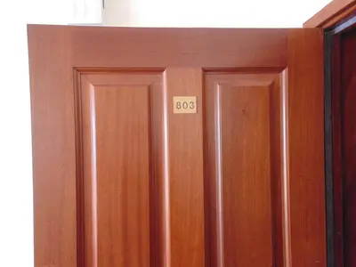 a pair of wooden doors with numbers on them at Casa Branca Apartments by Wanderlust Madeira, vacation rentals in Funchal