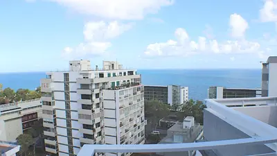 a view of the ocean from the balcony of a building at Casa Branca Apartments by Wanderlust Madeira, vacation rentals in Funchal