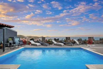 a swimming pool on the roof of a house at São Lourenço Guest House in Caniçal