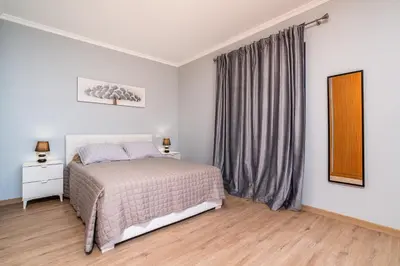 a bedroom with a bed and a window at Goncalves House - AC and private parking in Calheta