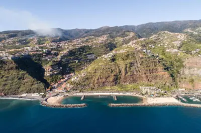an aerial view of a mountain with a beach at Goncalves House - AC and private parking in Calheta