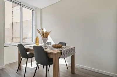 a dining room with a table and chairs at Carmo Charm Apartment by Homie in Funchal