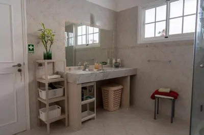 a bathroom with a sink and a mirror at Villa-Kasia Ocean View Studios in Caniço