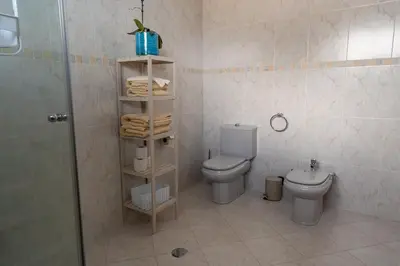 a bathroom with a toilet and a sink and a shower at Villa-Kasia Ocean View Studios in Caniço