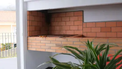 a brick wall with a stove inside of a building at Quinta do Carmo house with View in Calheta