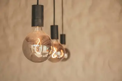 a group of light bulbs hanging from a wall at Slowing Villas - Villa Âncora in Porto Santo