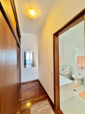 a bathroom with a toilet and a bath tub at Moradia Abreu in Santa Cruz