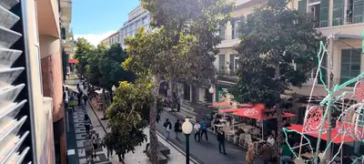 a view of a street with people walking down the street at Hostel Monaco in Funchal
