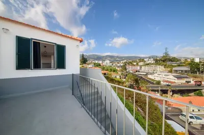 a balcony with a view of a city at Casa das Virtudes by Mth in Funchal