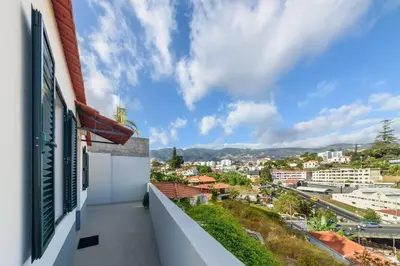 a balcony with a view of a city at Casa das Virtudes by Mth in Funchal