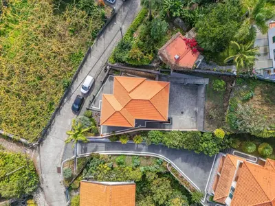 an overhead view of a house with an orange roof at Palm Tree House by Homie in Ponta Delgada