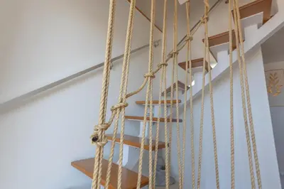 a rope staircase in a house at Flowers island house 5 in Funchal