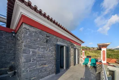 a view of a house with a patio at Casa Cabral by MTH in Ponta do Sol