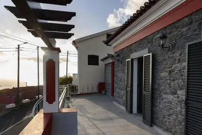 a view of a house with a balcony at Casa Cabral by MTH in Ponta do Sol