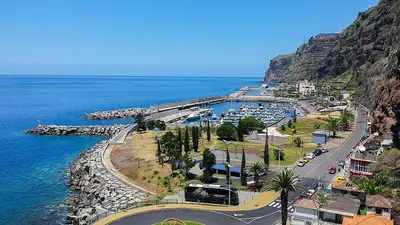 a town on the side of a mountain next to the ocean at Beautiful View 3 Arco da Calheta - Ilha da Madeira in Arco da Calheta