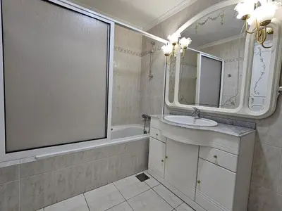 a bathroom with a sink and a mirror and a tub at Vista Mar Forum by Rentallido in Funchal