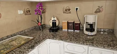 a kitchen counter with a coffee maker and a coffeemaker at Margarita House in Funchal