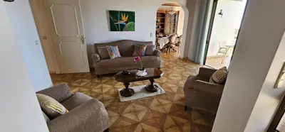 a living room with two couches and a table at Margarita House in Funchal