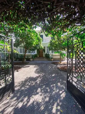 an open gate in front of a house at Casa da Avó Luísa in Funchal