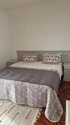 a large bed with pillows on it in a bedroom at Vila Boa Nova Funchal in Funchal