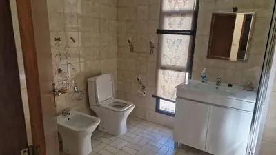 a bathroom with a toilet and a sink at Vila Boa Nova Funchal in Funchal
