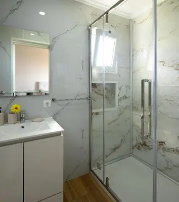 a bathroom with a shower and a sink at Franco's House, mar e serra in Estreito da Calheta