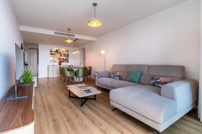 a living room with a couch and a table at Eden Loft by Madeira Dream Stays in Funchal