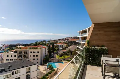 an apartment balcony with a view of a city at Eden Loft by Madeira Dream Stays in Funchal