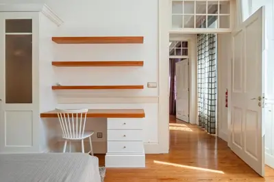 a bedroom with a desk and a chair at Villa Diniz by Madeira Dream Stays in Funchal