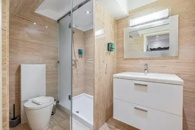 a bathroom with a toilet and a sink and a shower at Villa Diniz by Madeira Dream Stays in Funchal
