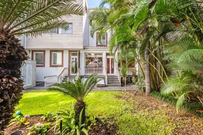a house with palm trees in front of it at Villa Diniz by Madeira Dream Stays in Funchal