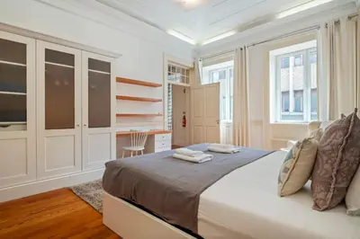 a white bedroom with a bed and a desk at Villa Diniz by Madeira Dream Stays in Funchal