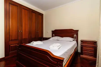 a bedroom with a bed with two towels on it at Vila do Conde Nº3 in Ribeira Brava
