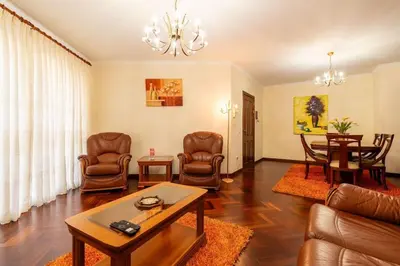 a living room with a couch and chairs and a table at Vila do Conde Nº3 in Ribeira Brava