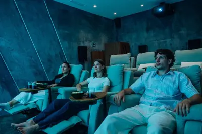 a group of people sitting in chairs in a room at Mea Suna in Arco da Calheta