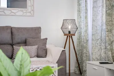 a living room with a couch and a lamp at Betty's Villa by ALMA Holiday Rentals in Funchal