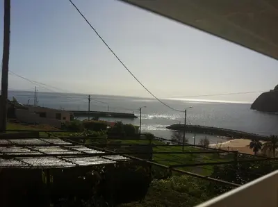 a view of the ocean from the balcony of a house at House on the Beach in Machico