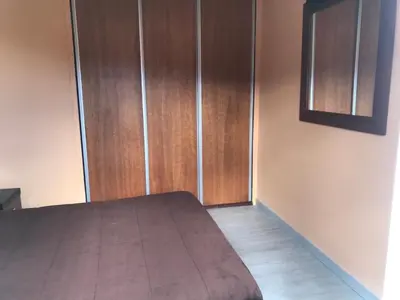 an open door to a bedroom with a bed at House on the Beach in Machico
