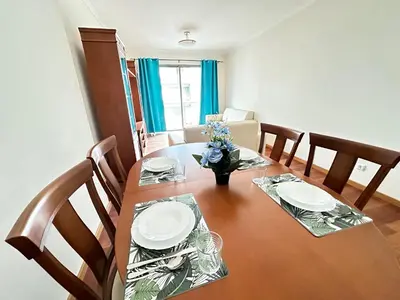 a bedroom with a large bed with blue curtains at Rooms for Rent Residence Funchal in Funchal