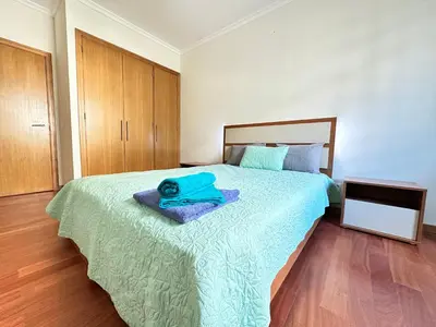 a bed with two pillows on top of it at Rooms for Rent Residence Funchal in Funchal