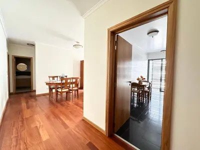 a living room with a couch and a window at Rooms for Rent Residence Funchal in Funchal