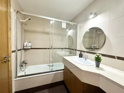 a kitchen with a sink and a table in it at Rooms for Rent Residence Funchal in Funchal